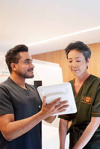 Woman looking at tablet with body holography